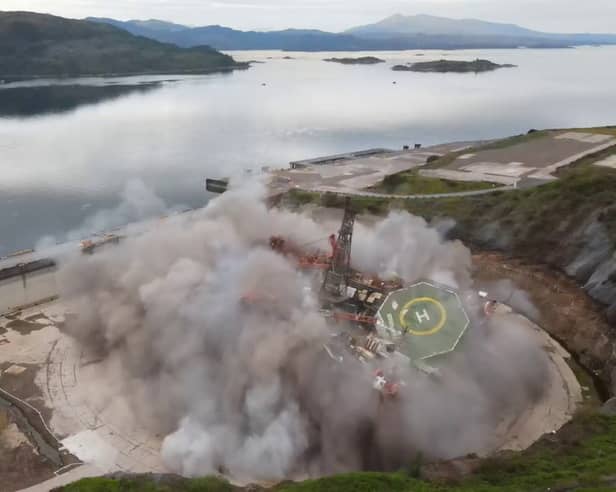 Striking footage shows a decommissioned oil rig being demolished with a controlled explosion, at Kishorn Port Limited's dry dock facility in Strathcarron, Wester Ross, Scotland