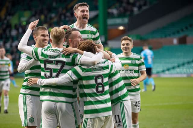 Celtic players celebrate (Photo by Steve  Welsh/Getty Images)