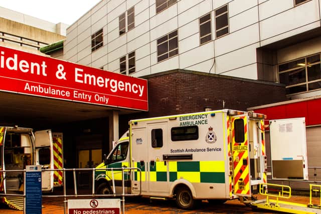 Castle Street, Glasgow, Scotland, UK; Ambulances at the entrance to the Accident and Emergency department of the Royal Infirmary.