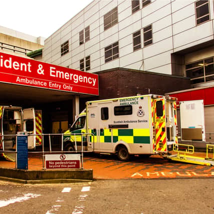 Castle Street, Glasgow, Scotland, UK; Ambulances at the entrance to the Accident and Emergency department of the Royal Infirmary.