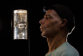 Artist, Wayne Binitie with glass sculpture containing air from the year 1765.  Picture: John Devlin