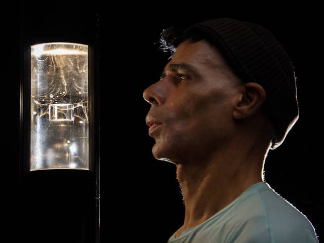 Artist, Wayne Binitie with glass sculpture containing air from the year 1765.  Picture: John Devlin