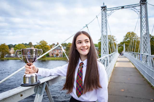 Maria Monk  from Glasgow Gaelic School is winner of the Solo Singing Fluent - Girls ages 13-15 - Traditional Silver Pendant at The Royal National MÃ²d 2021, in Inverness, 