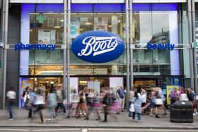 Members of the public walk past a branch of Boots the chemist (Pic from Getty)