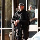 A police firearms officer is seen at the scene of a stabbing incident at Belfairs Methodist Church in Leigh-on-Sea, a district of Southend-on-Sea, in southeast England on October 15, 2021. - Conservative British lawmaker David Amess was killed on Friday after being stabbed "multiple times" during an event in his local constituency in southeast England, in the second death of a UK politician while meeting voters since 2016. Local police did not name Amess but said a man had been arrested "on suspicion (of) murder" after the stabbing in Leigh-on-Sea. (Photo by Tolga Akmen / AFP) (Photo by TOLGA AKMEN/AFP via Getty Images)