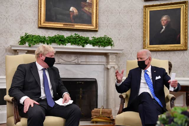 US President Joe Biden, pictured with Prime Minister Boris Johnson in the Oval Office in September, has confirmed his attendance at the COP26 climate conference.  (Photo: Nicholas Kamm/AFP via Getty Images)