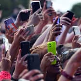 Unwanted and duplicate photos on our phones are contributing hundreds of thousand of tons of CO2 every year. (Pic from Getty Images) 