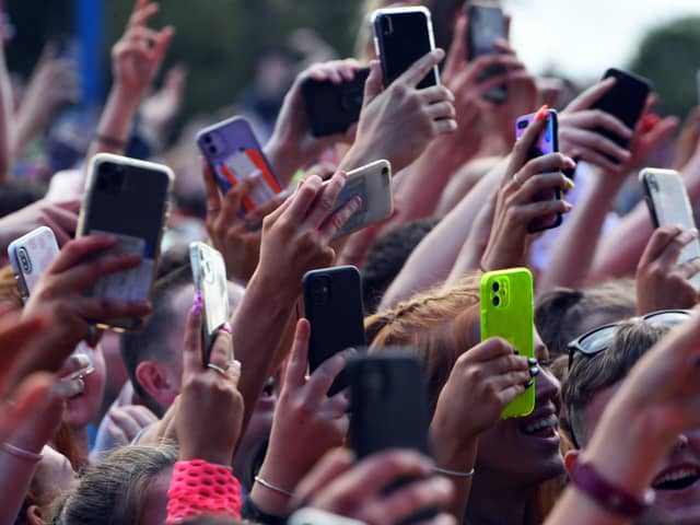 Unwanted and duplicate photos on our phones are contributing hundreds of thousand of tons of CO2 every year. (Pic from Getty Images) 