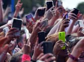 Unwanted and duplicate photos on our phones are contributing hundreds of thousand of tons of CO2 every year. (Pic from Getty Images) 