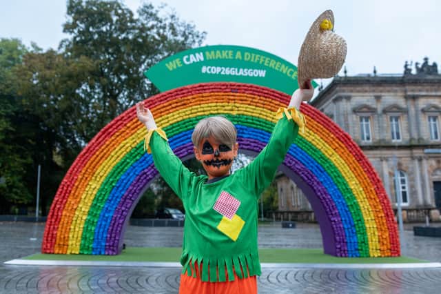 Theo Robertson, from Langside, shows off his Halloween costume in front of the giant rainbow.
