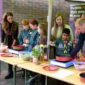 The Duke and Duchess helping the 105th Glasgow Scouts.