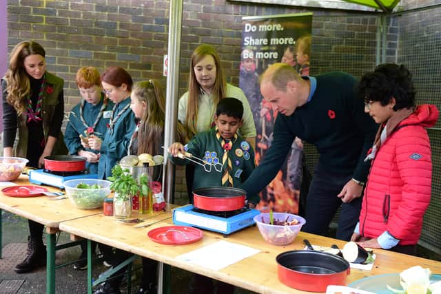 The Duke and Duchess helping the 105th Glasgow Scouts.