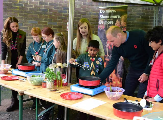 The Duke and Duchess helping the 105th Glasgow Scouts.