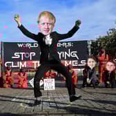 Climate change activists doing a Squid Game themed demonstration.