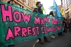 The protesters outside the Glasgow JP Morgan office.