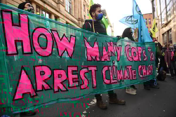 The protesters outside the Glasgow JP Morgan office.