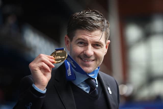 Steven Gerrard poses with his medal during the Scottish Premiership match between Rangers and Aberdeen on May 15, 2021 in Glasgow
