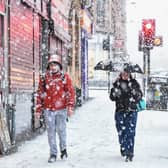  Members of the public make their way through a snow shower in Glasgow’s  West End in 2019.  (Photo by Jeff J Mitchell/Getty Images)
