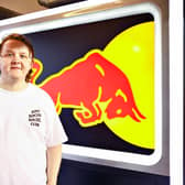 Lewis Capaldi poses for a photo in the Red Bull Racing garage after  practice ahead of the F1 Grand Prix of Abu Dhabi at Yas Marina Circuit on December 10, 2021.