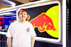 Lewis Capaldi poses for a photo in the Red Bull Racing garage after  practice ahead of the F1 Grand Prix of Abu Dhabi at Yas Marina Circuit on December 10, 2021.