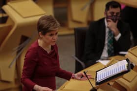 Nicola Sturgeon has announced that self-isolation has been cut from 10 days to seven day for those in Scotland. (Credit: Getty)