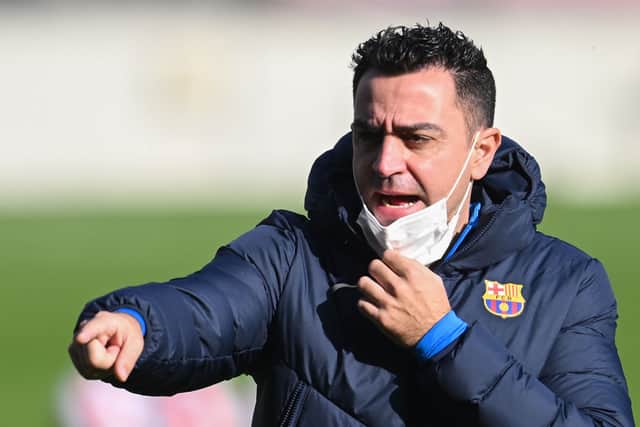 Head coach Xavi Hernandez of FC Barcelona directs his players during a training session at Camp Nou on January 03, 2022 in Barcelona, Spain.