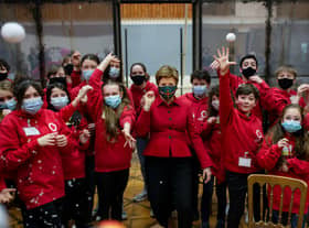 First Minister Nicola Sturgeon with the children’s chorus of A Midsummer Night’s Dream during her visit to Scottish Opera’s Production Studios. 