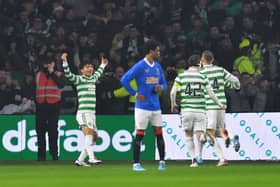 Reo Hatate of Celtic celebrates with team-mates after scoring the opening goal during the Cinch Scottish Premiership match between Celtic FC and Rangers FC at  on February 02, 2022 in Glasgow, Scotland
