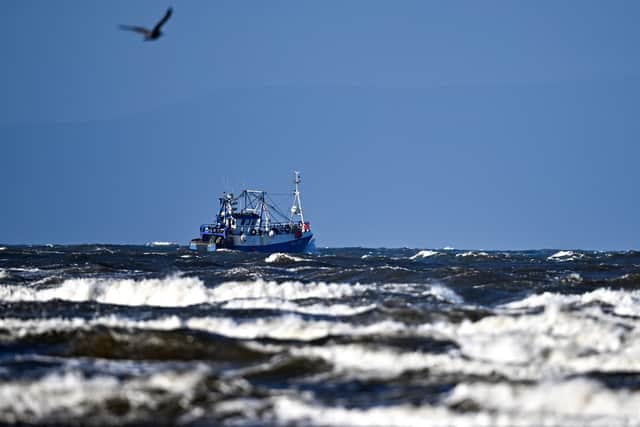 A view of a fishing trawler leaving Troon Harbour on February 21, 2022 in Troon, United Kingdom. Storm Franklin, which has prompted flood warnings and severe weather alerts across the UK, is the third storm to hit the UK in a week, following Eunice and Dudley. (Photo by Jeff J Mitchell/Getty Images)