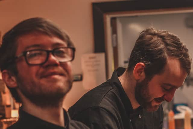 Sean Breslin, left, working as a chef.