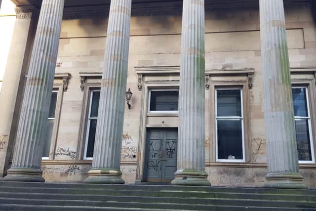 There is graffiti all over the former Royal Bank of Scotland building.