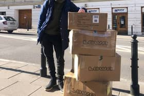 Glasgow University graduate Oleksii Rudenko with some boxes of equipment.
