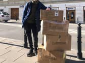 Glasgow University graduate Oleksii Rudenko with some boxes of equipment.