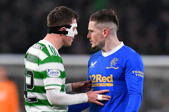 allum McGregor of Celtic speaks with Ryan Kent of Rangers during the Cinch Scottish Premiership match between Celtic FC and Rangers FC at  on February 02, 2022