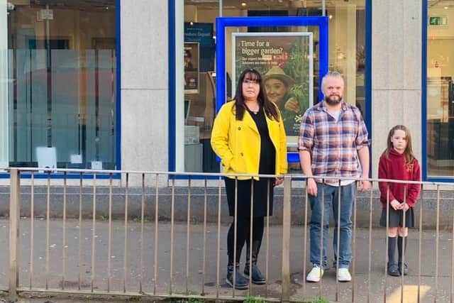 SNP council candidates for the area, Cllr Annette Ireland and David Tam McDonald, outside the BoS branch.