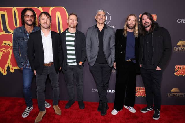 Rami Jaffee, Chris Shiflett, Nate Mendel, Pat Smear, Taylor Hawkins, and Dave Grohl of Foo Fighters attend the Los Angeles premiere of "Studio 666"