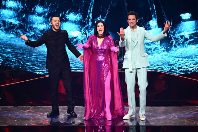 Italian television presenter Alessandro Cattelan, Italian singer Laura Pausini and Lebanese-born British singer-songwriter, Mika cheer the audience during the first semi-final of the Eurovision song contest 2022