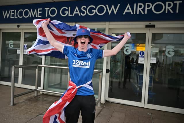 Rangers fans gather at Glasgow airport as they depart Scotland ahead of the Europa League final on May 17