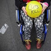 Anti austerity protesters prepare to throw balls towards Downing Street after the Chancellor of the Exchequer George Osborne left 11 Downing Street on July 8, 2015 in London, England. Photo by Dan Kitwood/Getty Images