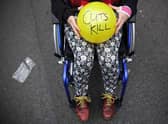 Anti austerity protesters prepare to throw balls towards Downing Street after the Chancellor of the Exchequer George Osborne left 11 Downing Street on July 8, 2015 in London, England. Photo by Dan Kitwood/Getty Images