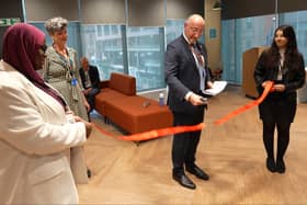 Jim Harra cuts the ribbon.