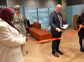 Jim Harra cuts the ribbon.