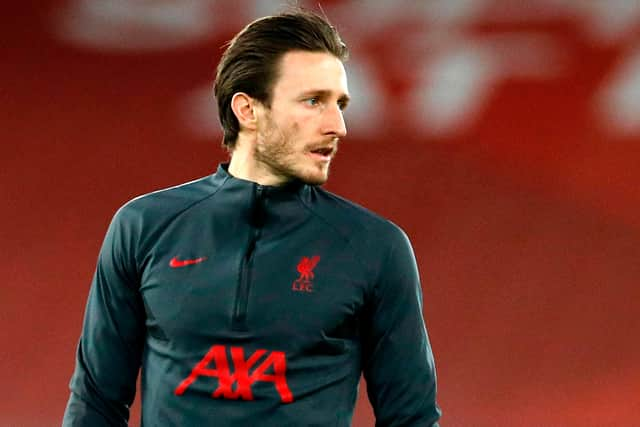 Ben Davies warms up for Liverpool. Picture: PHIL NOBLE/POOL/AFP via Getty Images