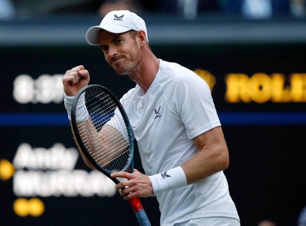 <p>Britain’s Andy Murray celebrates winning a game during his men’s singles tennis match against Australia’s James Duckworth on the first day of the 2022 Wimbledon Championships. (Photo by Adrian DENNIS / AFP)</p>