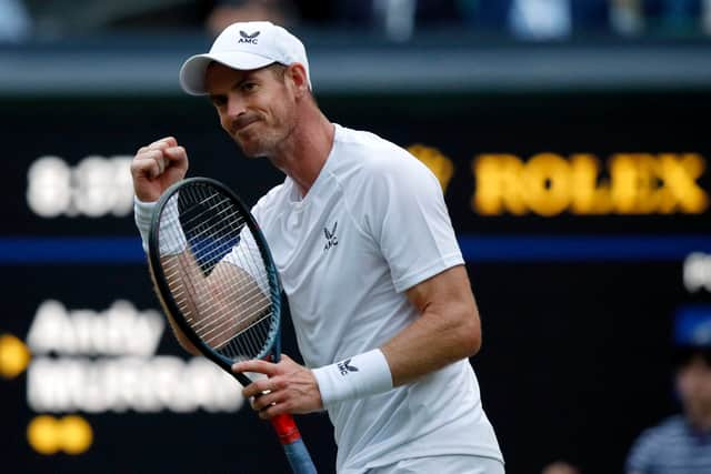 Britain’s Andy Murray celebrates winning a game during his men’s singles tennis match against Australia’s James Duckworth on the first day of the 2022 Wimbledon Championships. (Photo by Adrian DENNIS / AFP)