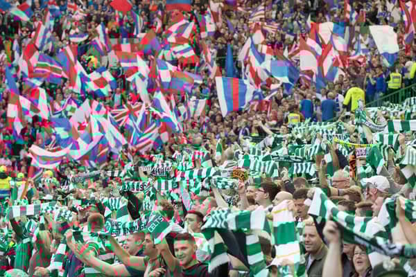 Celtic and Rangers supporters get behind their sides (Photo by Steve  Welsh/Getty Images)