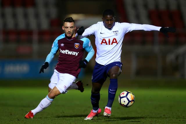 Shilow Tracey of Tottenham tackles with Sead Haksabanovic of West Ham during the Premier League 2 match between West Ham United and Tottenham Hotspur at Chigwell Construction Stadium on February 12, 2018