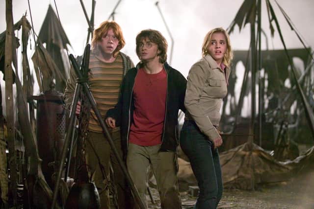 RUPERT GRINT as Ron Weasley, DANIEL RADCLIFFE as Harry Potter and EMMA WATSON as Hermione Granger in Warner Bros. Pictures’ ‘Harry Potter and the Goblet of Fire'