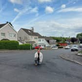 Cllr Kerr on one of the repaired roads.