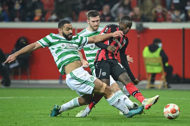 Celtic's US defender Cameron Carter-Vickers (L) and Leverkusen's French forward Moussa Diaby (R) vie for the ball during the UEFA Europa League Group G football match Bayer 04 Leverkusen v Celtic 